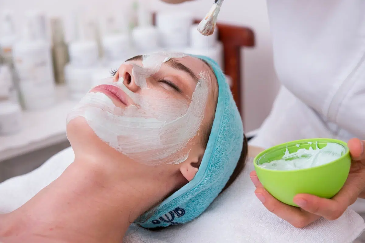 Licensed esthetician performing post-facial skin consultation at AVES Beauty San Francisco